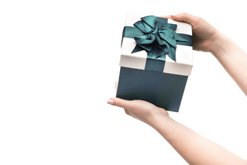 Woman hands holds present gift box