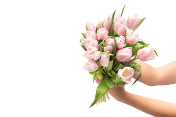 Woman hand holds a bouquet of tulips