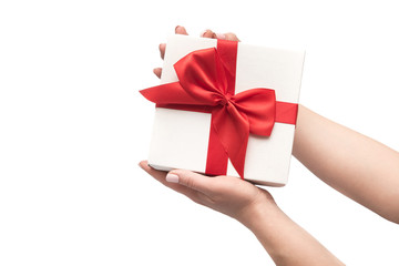 Woman hands holds present gift box