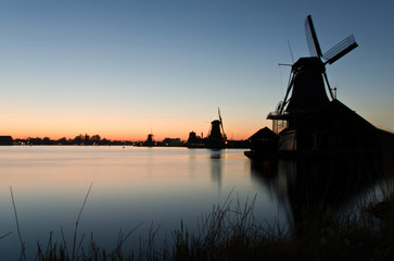 Fototapeta na wymiar Windmills in Zaanse Schans at dusk, The Netherlands