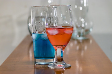 blue and red liquid in glasswear