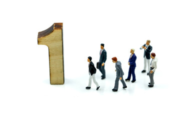 Miniature people : Businessman and team with wooden number of 1,2,3 , to be the first,business competition concept.