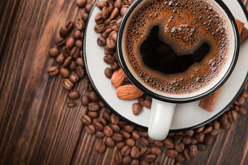 White coffee cup with roasted beans