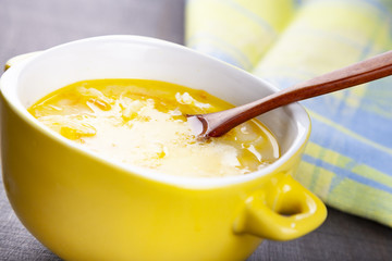 Cheese soup in a yellow plate