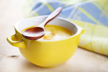 Cheese soup in a yellow plate