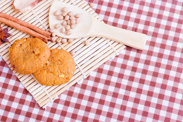 cereal cookies with spoon spice on wooden bamboo and tablecloth .copy space for text. top view