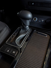 Fototapeta na wymiar Detail of modern car interior, gear stick, automatic transmission in expensive car