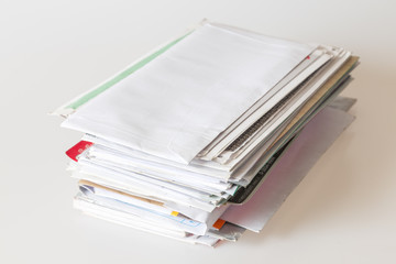 Pile of mails on white background