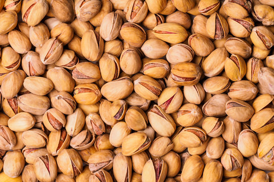 Pistachio texture. Nuts. Roasted salted pistachio nuts healthy delicious food studio photo.