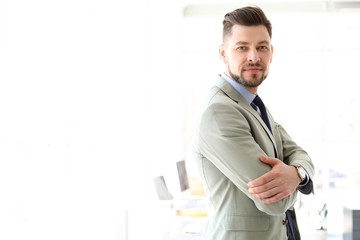 Fototapeta premium Male lawyer standing in light office