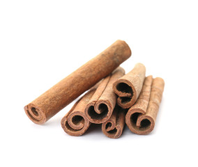 Aromatic cinnamon sticks on white background