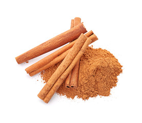 Aromatic cinnamon sticks and powder on white background