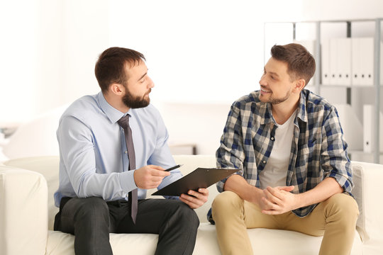 Consulting manager with man at meeting in office