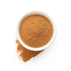 Bowl with aromatic cinnamon powder on white background