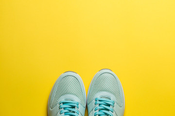 Bordeaux sneakers with white soles on a blue background close-up