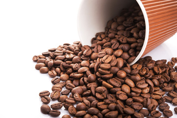 paper cup filled with coffee beans