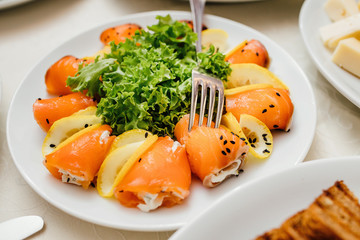 catering table set service with silverware and glass stemware at