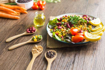 Healthy food background : salad bowl on wooden table.