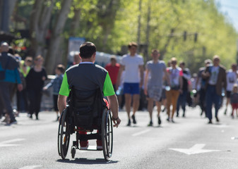 Man in wheelchair on marathon