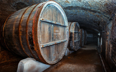 Old Wooden Barrels In The Vintage Wine Cellar.  Lefkadia, Russia
