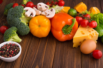 Fresh raw vegetabels with a piece of cheese