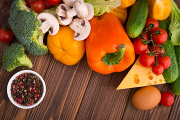 Fresh raw vegetabels with a piece of cheese
