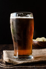 Cool Refreshing Amber Beer with Snacks.