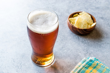 Cool Refreshing Amber Beer with Snacks.