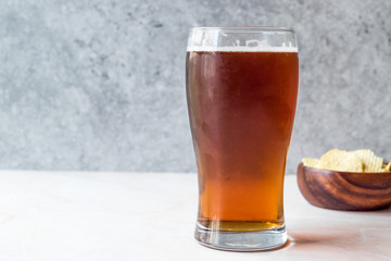 Cool Refreshing Amber Beer with Snacks.