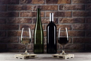 Red and white wine glasses on pallet