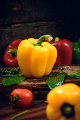 Bell pepper with vegetables on the old wooden floor