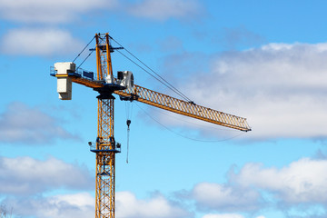 Crane building the power station. Sky background.