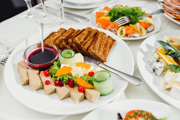 catering table set service with silverware and glass stemware at