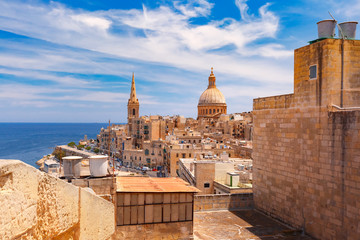 Fototapeta na wymiar View from above of roofs and church of Our Lady of Mount Carmel and St. Paul's Anglican Pro-Cathedral, Valletta, Capital city of Malta