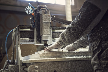 Man operating CNC Machine