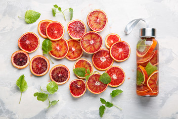 Detox infused water flavored with bloody orange and mint. Healthy refreshing beverage.