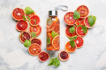 Detox infused water flavored with bloody orange and mint. Healthy refreshing beverage.