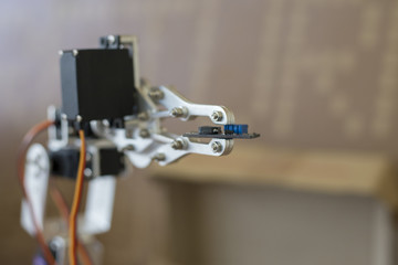 Photo of robot manipulator, which holds the chip
