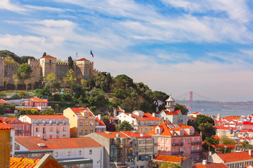 Fototapeta na wymiar The Castle of Sao Jorge, the historical centre of Lisbon, Tagus River and 25 de Abril Bridge on the sunny afternoon, Lisbon, Portugal