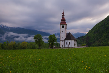 Fototapeta na wymiar Typical slovenian church in the mountains, near Bohinj lake. Slovenia