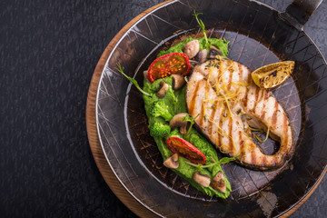 Tasty fish steak with vegetables