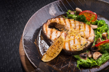 Tasty fish steak with vegetables