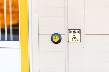 button at the entrance as help for disabled on wheelchair and invalids