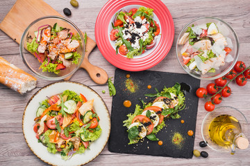 Food set with greek salad, seafood with mussels, caprese, vegetables