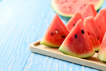 Slice of watermelon on blue wood