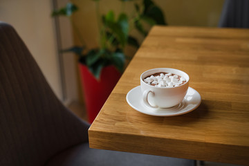 White coffee cup with dessert marshmallow