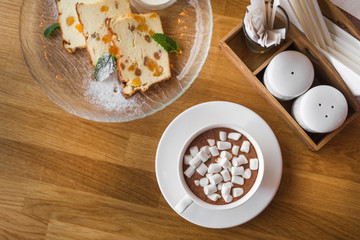 White coffee cup with dessert marshmallow