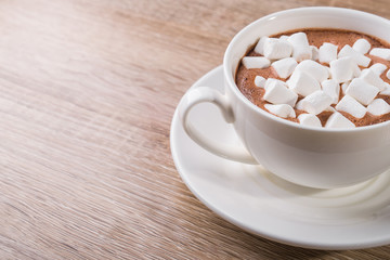 White coffee cup with dessert marshmallow