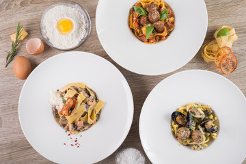 Food set of pasta with mushrooms, meat balls and chicken