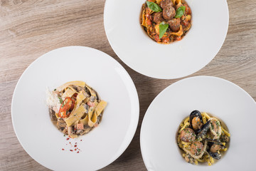 Food set of pasta with mushrooms, meat balls and chicken